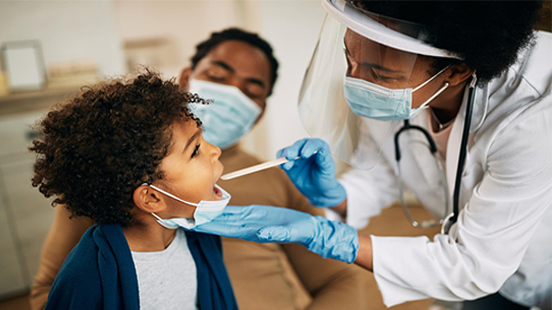Doctor examining a young child
