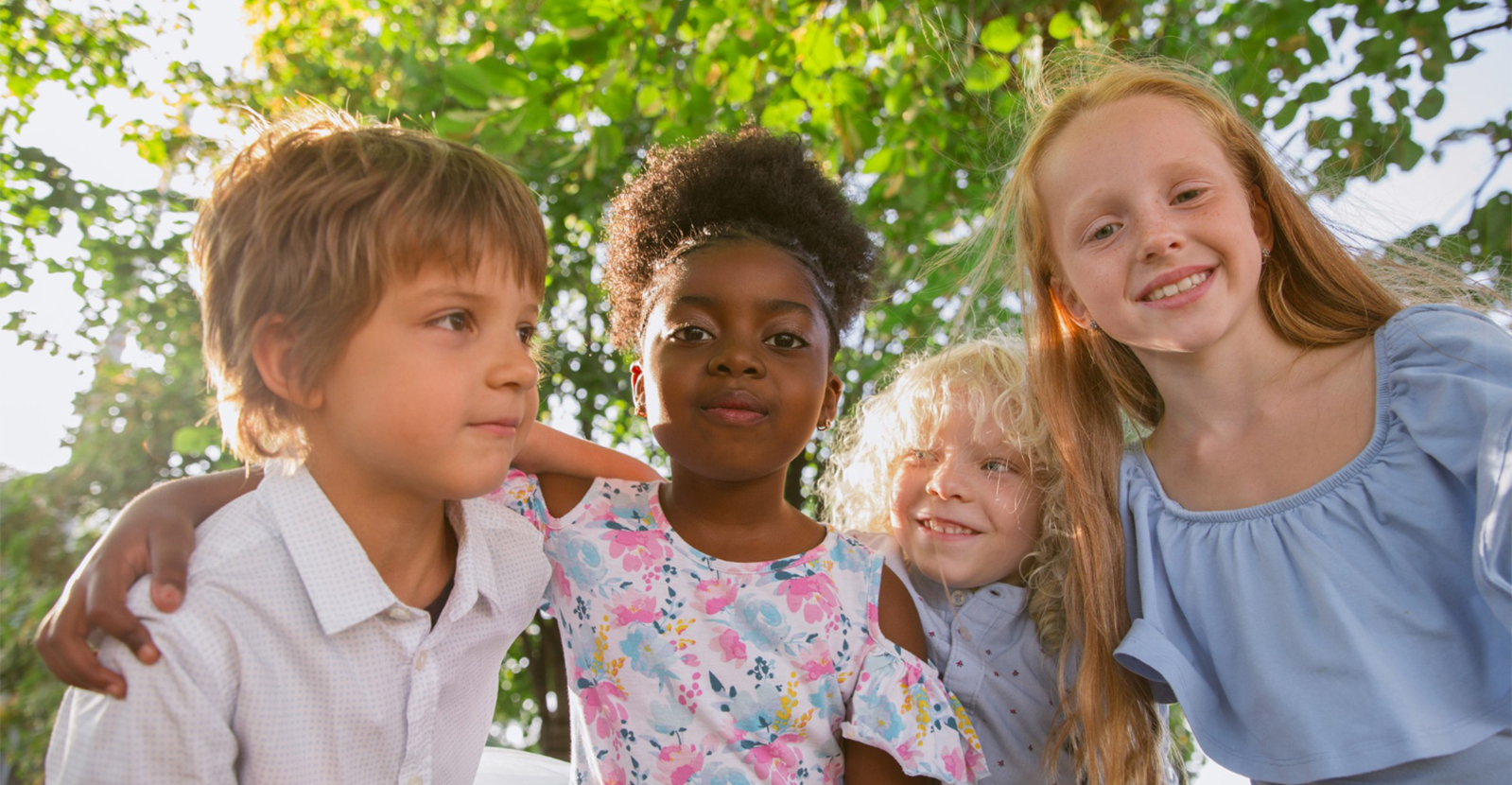 Children smiling together outdoors
